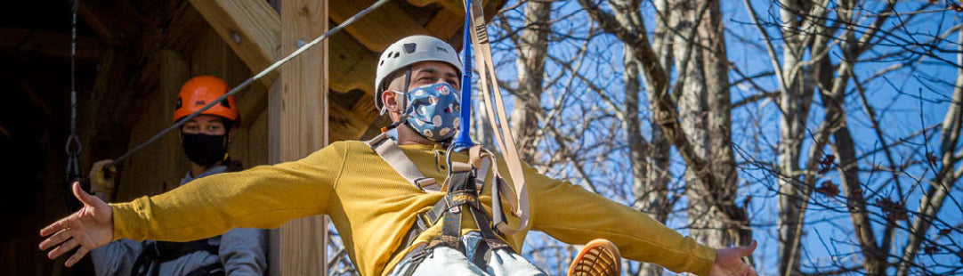 man with mask on canopy zip tour at High Gravity Adventures 